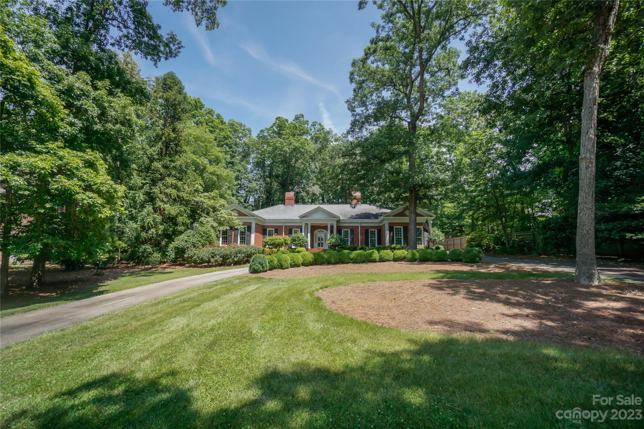 620 North 9th Street, Unit 5/6 Albemarle, NC 28001 - Photo 2 of 48 a front view of a house with a yard and trees