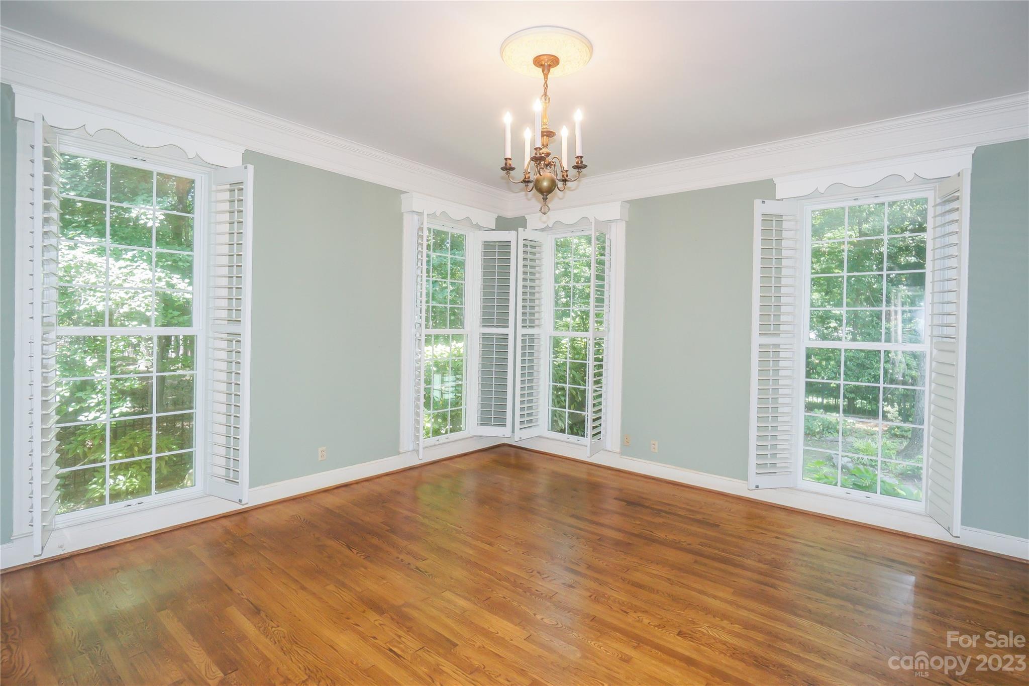 620 North 9th Street, Unit 5/6 Albemarle, NC 28001 - Photo 23 of 48 a view of an empty room with wooden floor and a window