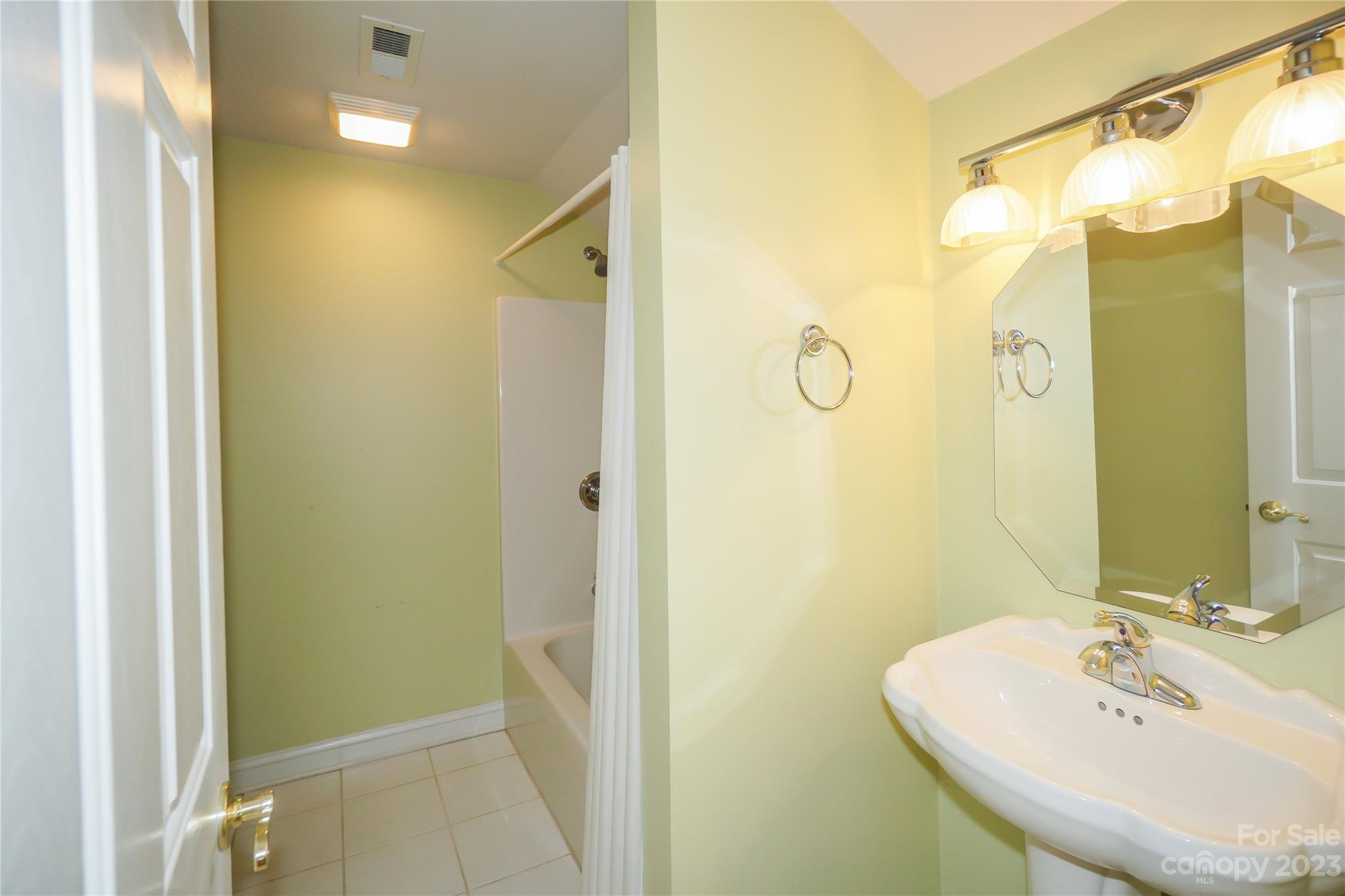 620 North 9th Street, Unit 5/6 Albemarle, NC 28001 - Photo 38 of 48 a bathroom with a sink and a mirror