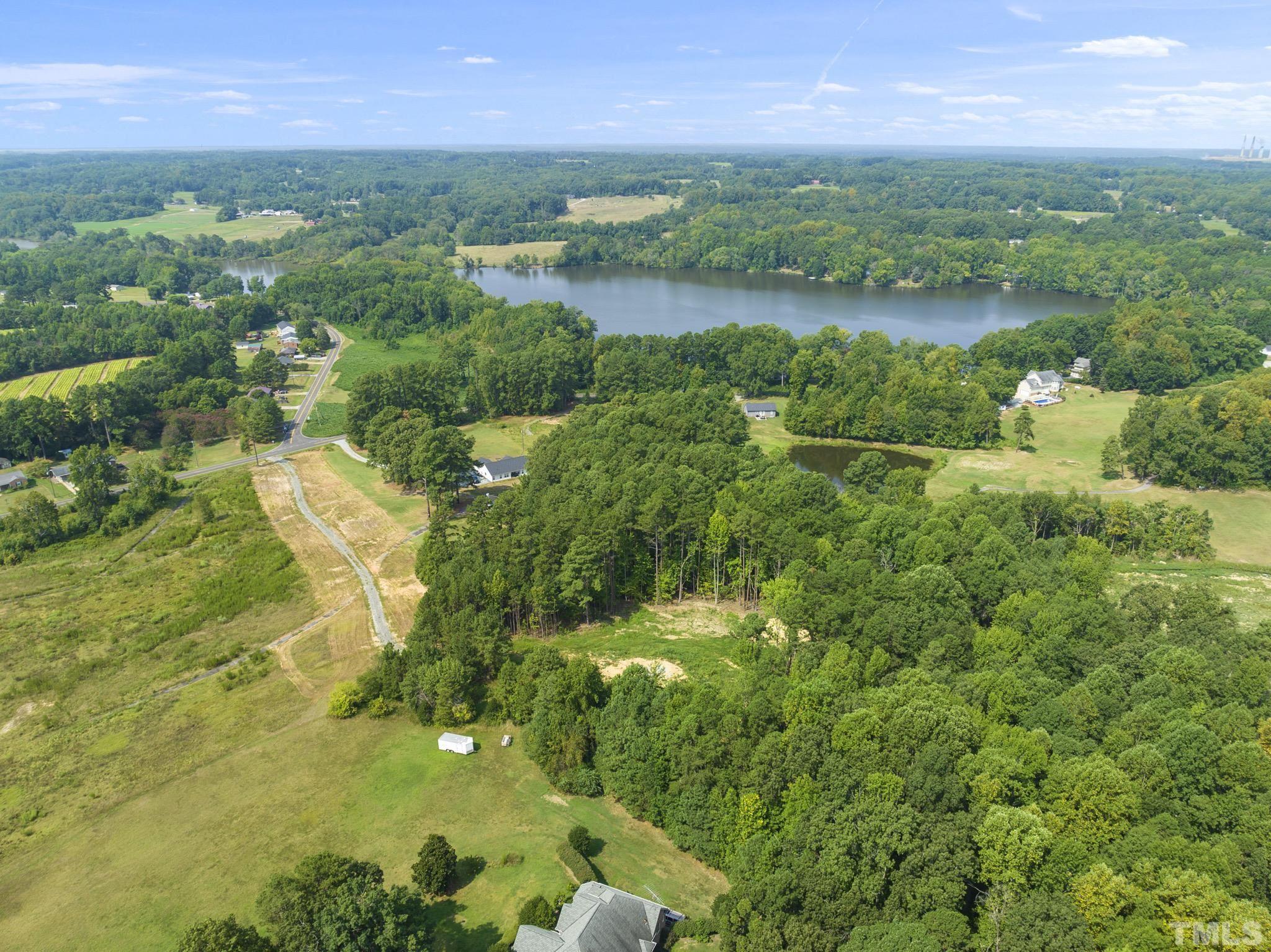 Lot D Chub Lake Road Roxboro, NC 27574 - Photo 11 of 29 a view of a lake with a city