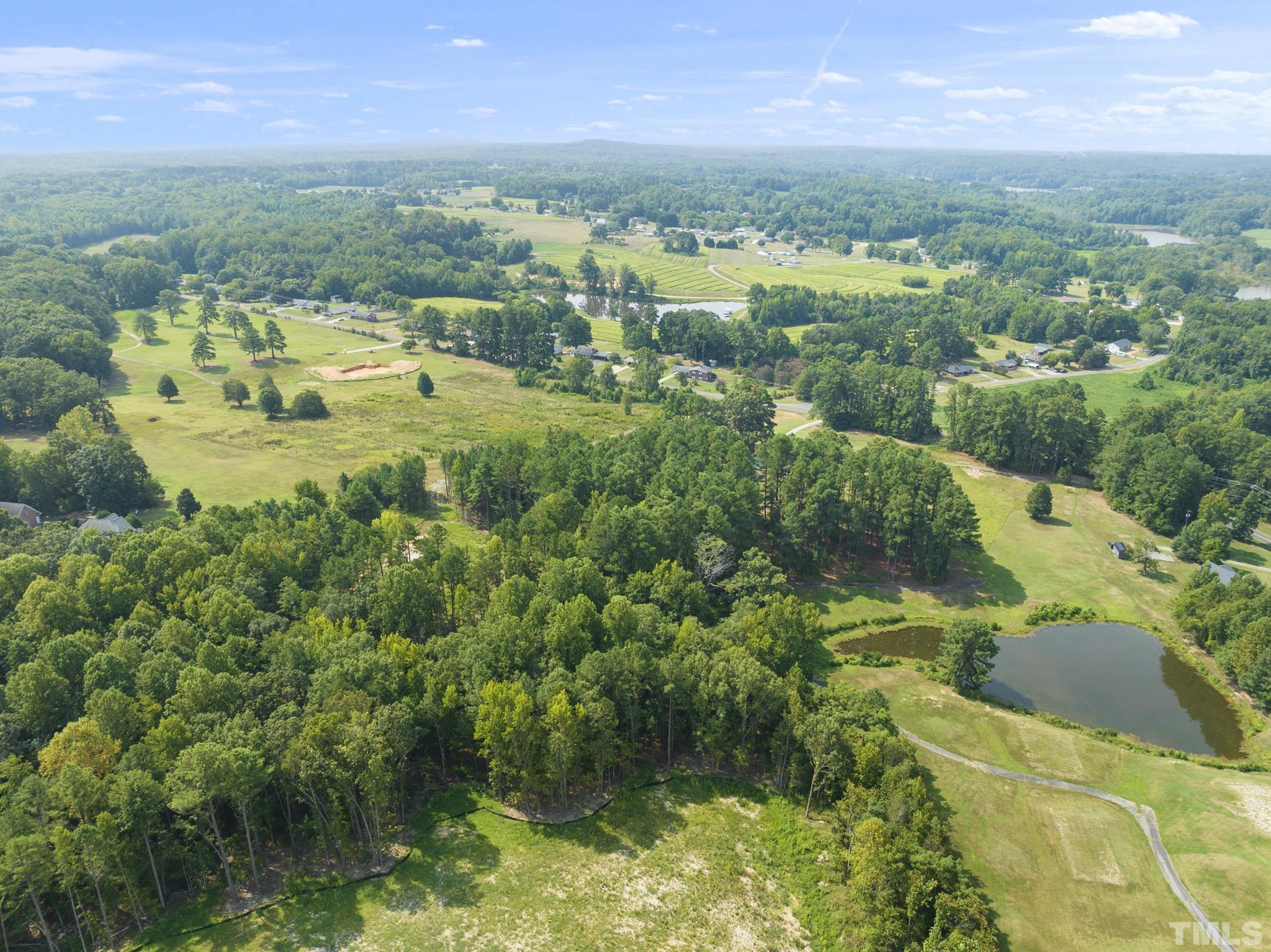 Lot D Chub Lake Road Roxboro, NC 27574 - Photo 14 of 29 an aerial view of residential houses with outdoor space and trees