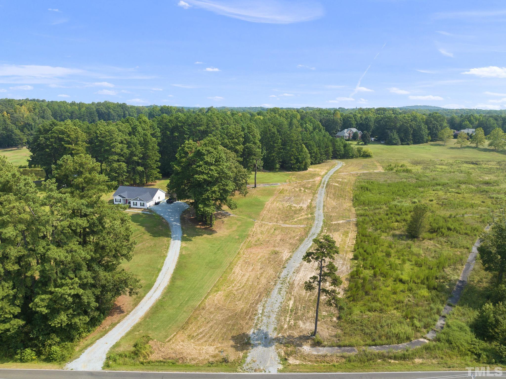 Lot D Chub Lake Road Roxboro, NC 27574 - Photo 3 of 29 a view of a yard with an tree
