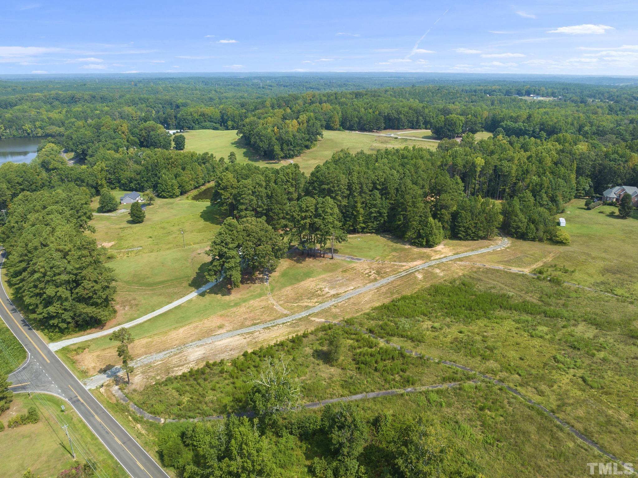 Lot D Chub Lake Road Roxboro, NC 27574 - Photo 6 of 29 a view of a yard with a lake