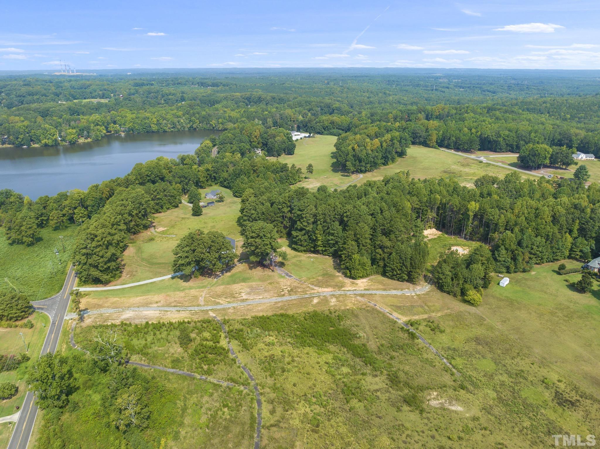 Lot D Chub Lake Road Roxboro, NC 27574 - Photo 8 of 29 a view of a lake with a building in the background