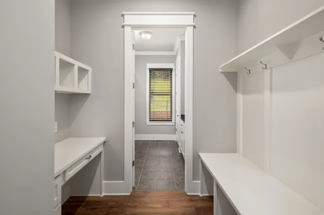 a view of hallway with wooden floor