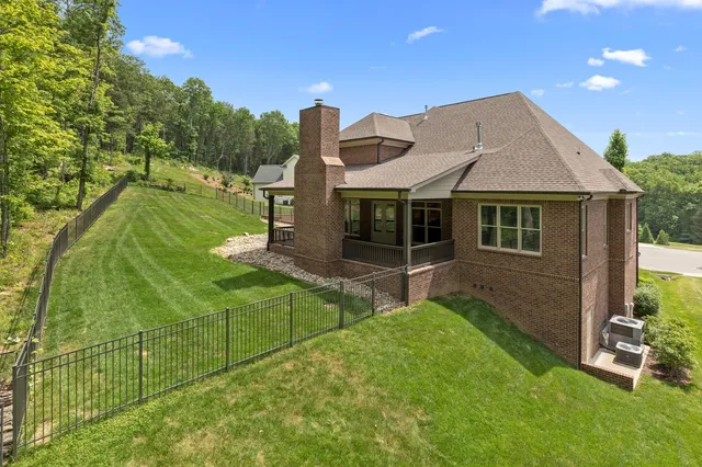 a aerial view of a house with swimming pool