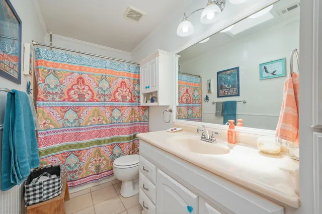 a bedroom with a bed and dresser