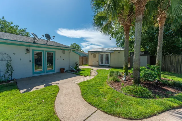an aerial view of a house with outdoor space