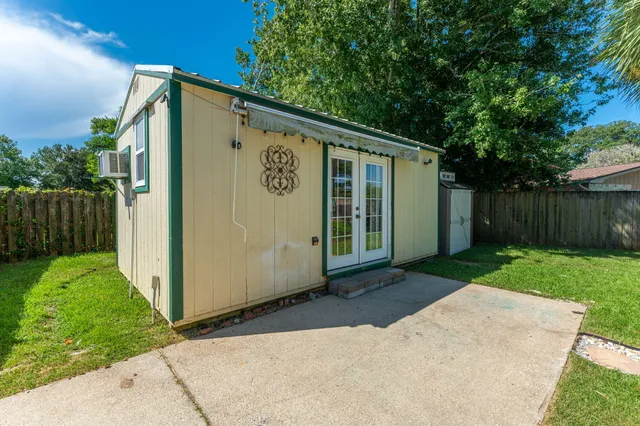 a front view of a house with a garden