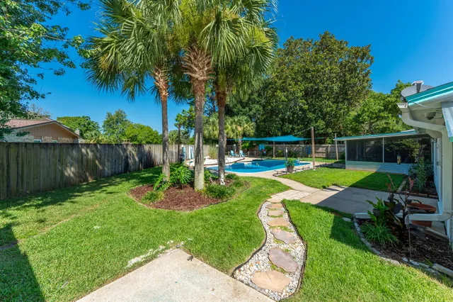 a view of a swimming pool with a garden