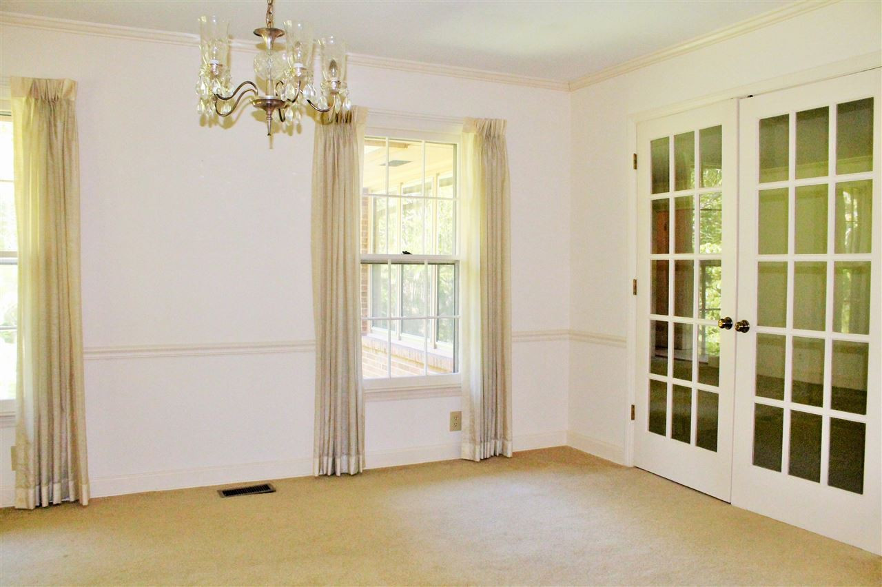 The large formal Dining Room can handle a large table for gathering around. The French doors give an open feel even when they are closed for more private meals. Dining Room
