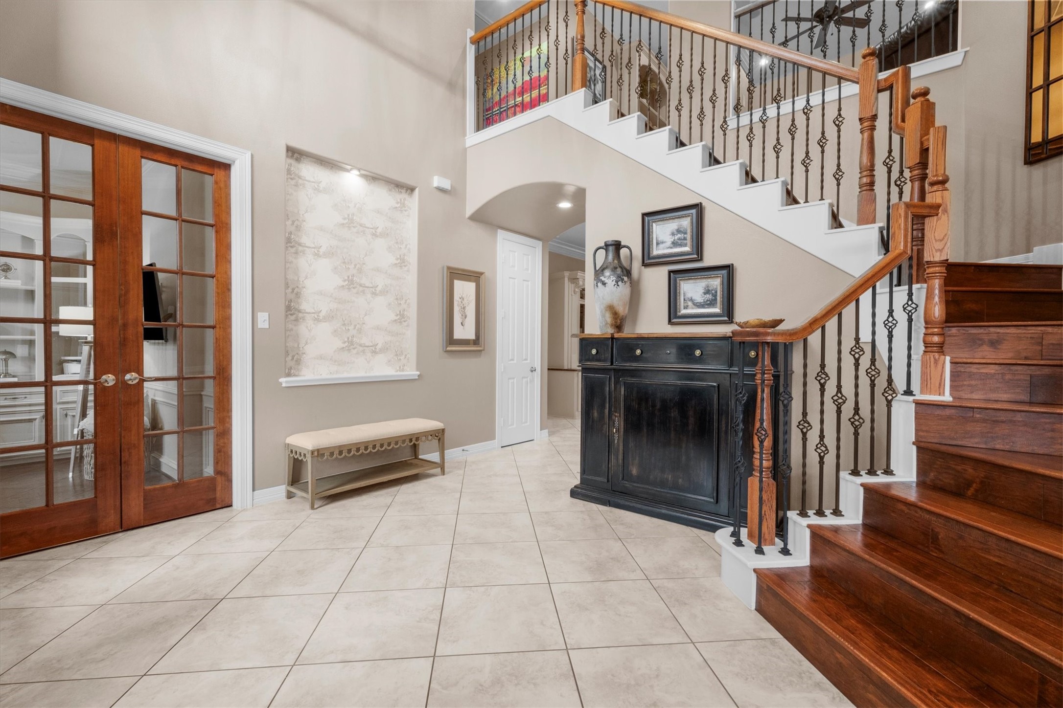 15415 Prade Ranch Lane Cypress, TX 77429 - Photo 12 of 50 Wrought iron staircase with wooden stairs.