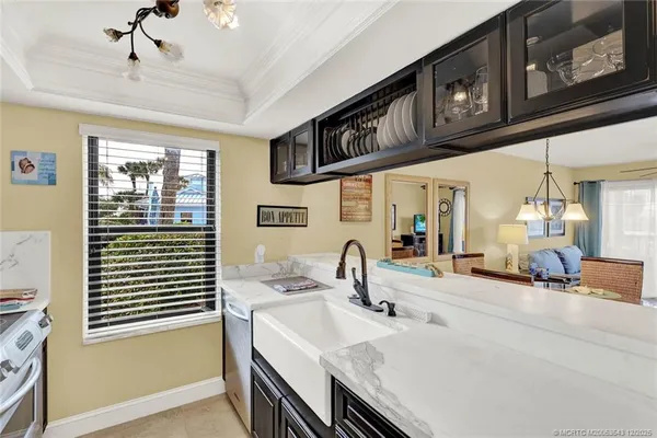 a kitchen with stainless steel appliances kitchen island granite countertop a sink and cabinets