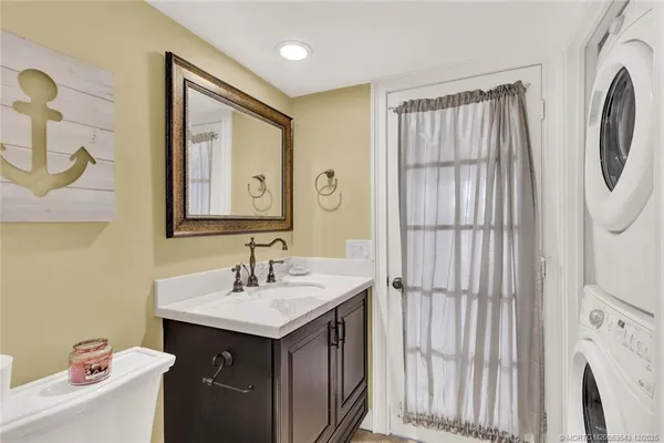 a bathroom with a sink vanity and a mirror
