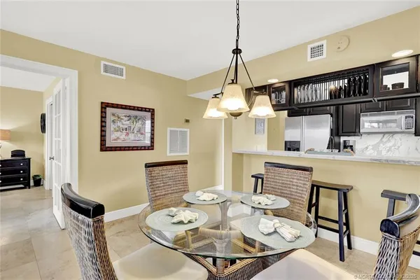 a view of a dining room with furniture