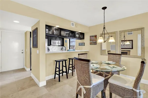 a view of a dining room with furniture