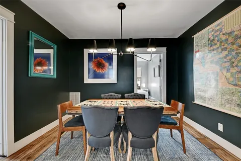 a dining room with furniture and window