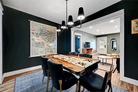 a view of a dining table and chairs in a room