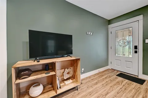 a room with furniture and flat screen tv