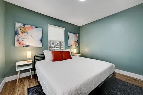 a bedroom with a bed and a table in it