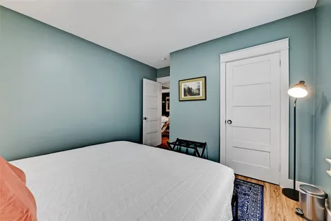 a bedroom with a bed and a cabinets