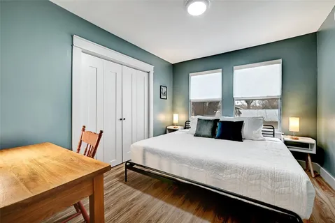 a bedroom with a bed and a table