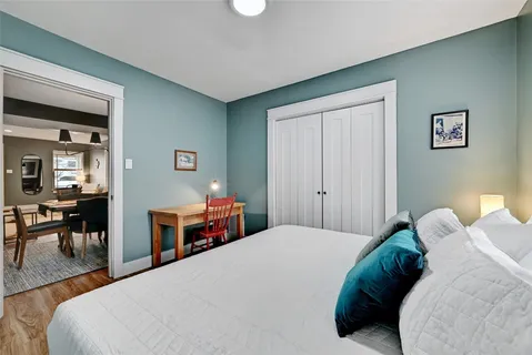 a bedroom with a bed and table in it