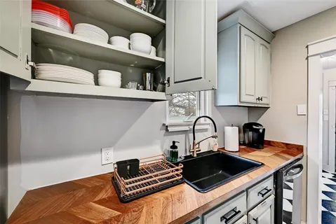 a kitchen with a stove and a sink