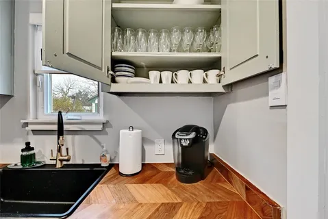 a kitchen with a stove and a window