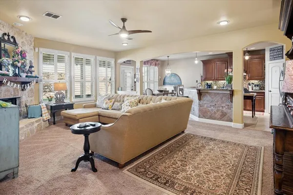a living room with furniture and a rug