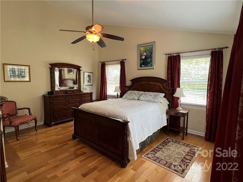19 Osborne Road Asheville, NC 28804 - Photo 11 of 35 a bedroom with a bed and wooden floor