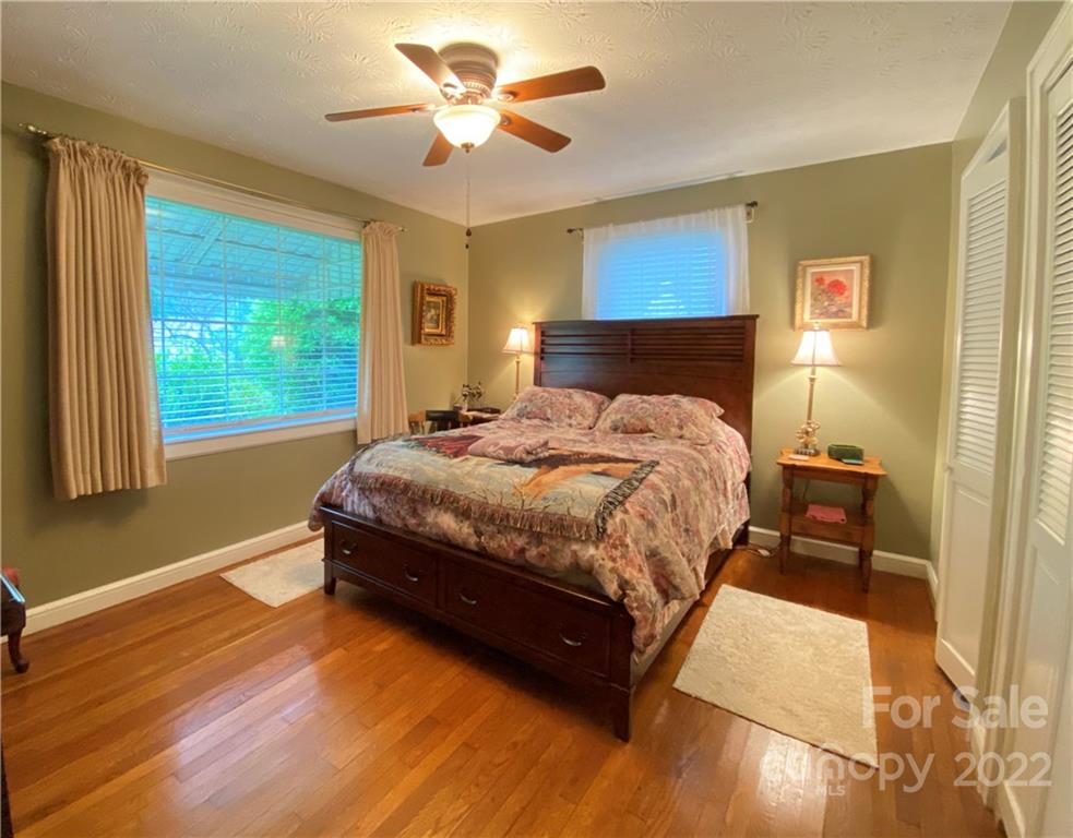 19 Osborne Road Asheville, NC 28804 - Photo 15 of 35 a bedroom with a bed and a window