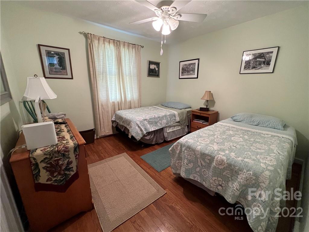 19 Osborne Road Asheville, NC 28804 - Photo 17 of 35 a bedroom with two beds and a window