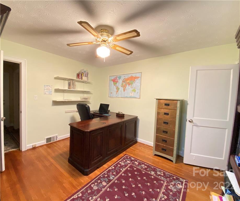 19 Osborne Road Asheville, NC 28804 - Photo 19 of 35 a view of a workspace with furniture and wooden floor