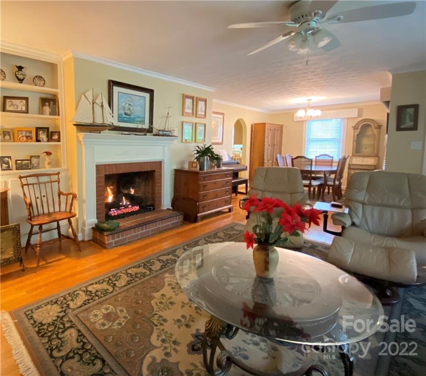 19 Osborne Road Asheville, NC 28804 - Photo 2 of 35 a living room with furniture and a fireplace