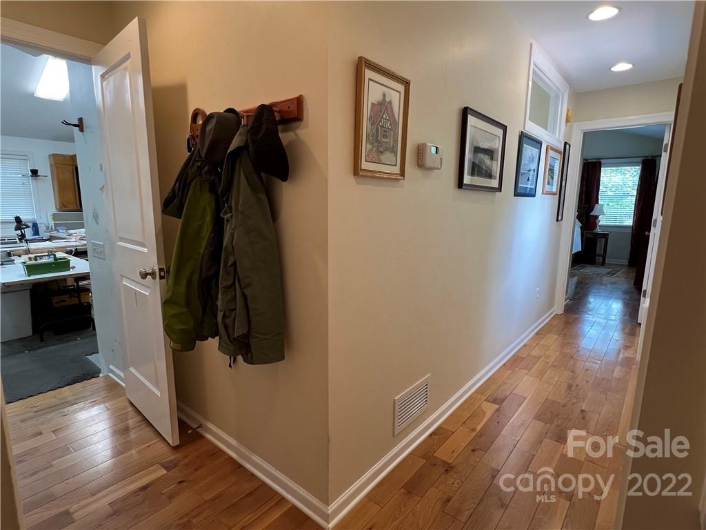 19 Osborne Road Asheville, NC 28804 - Photo 23 of 35 a walk in closet with wooden floor