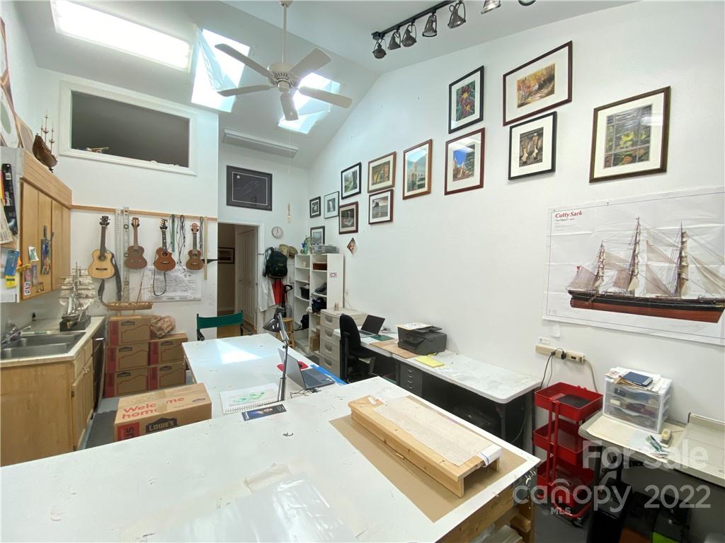 19 Osborne Road Asheville, NC 28804 - Photo 24 of 35 a living room with furniture and a floor to ceiling window