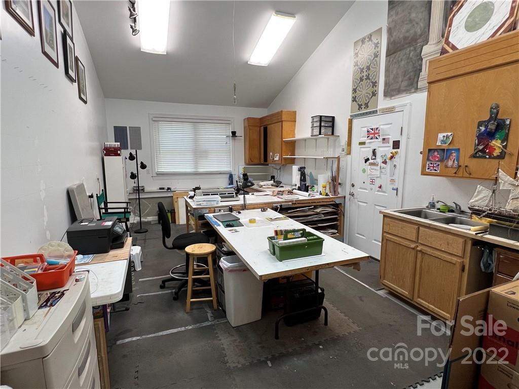 19 Osborne Road Asheville, NC 28804 - Photo 25 of 35 a living room with lots of furniture and appliances