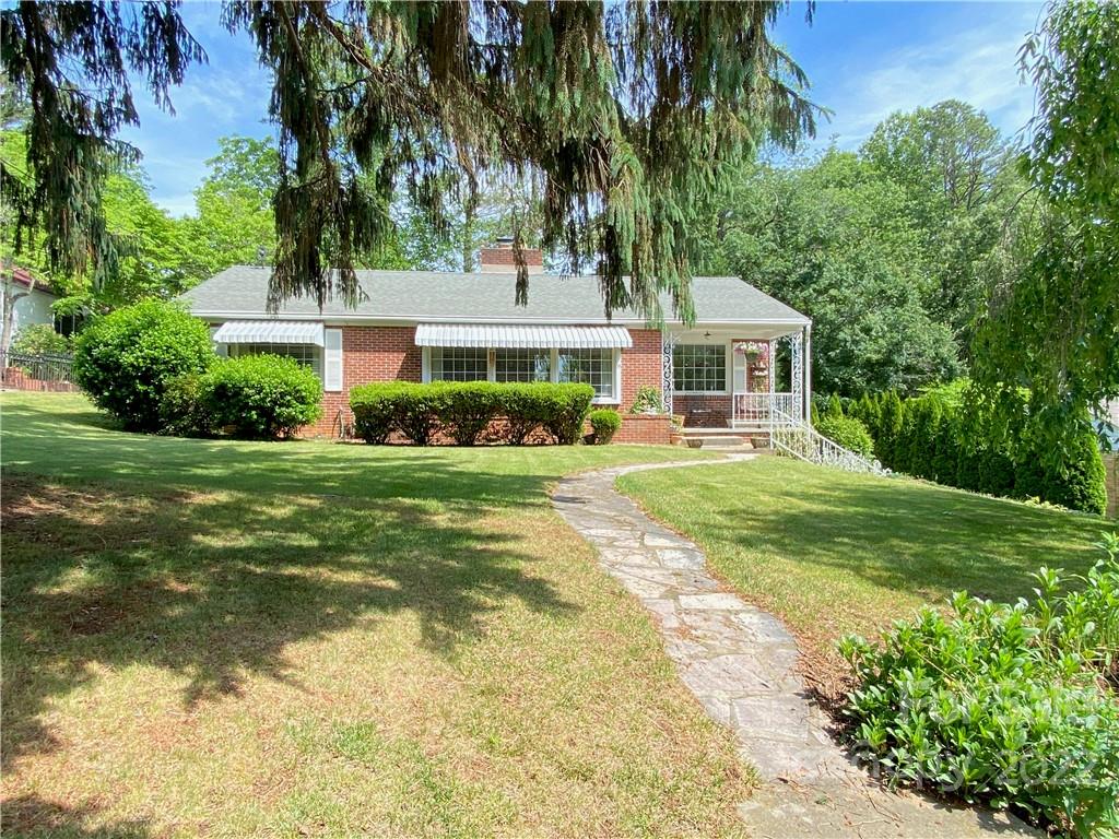 19 Osborne Road Asheville, NC 28804 - Photo 27 of 35 a front view of a house with garden