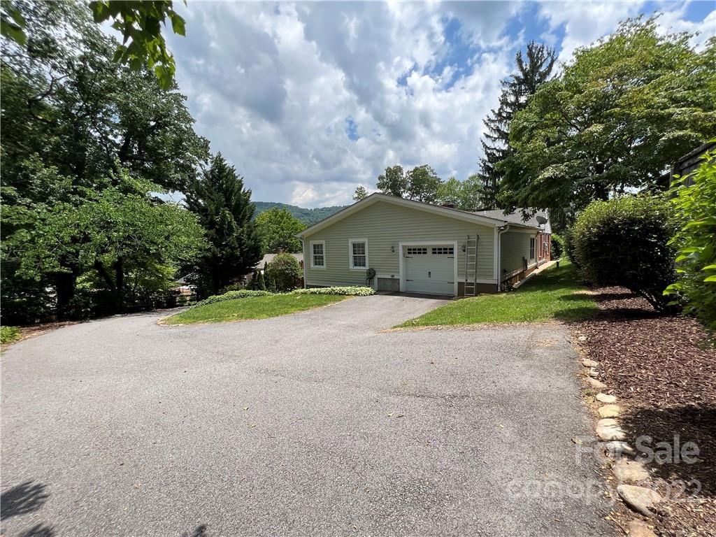 19 Osborne Road Asheville, NC 28804 - Photo 29 of 35 a view of house with yard and trees in front of it