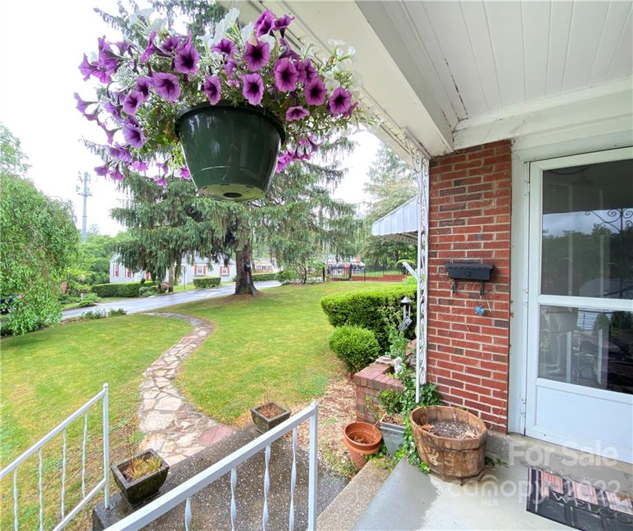 19 Osborne Road Asheville, NC 28804 - Photo 30 of 35 a view of a patio with table and chairs and potted plants