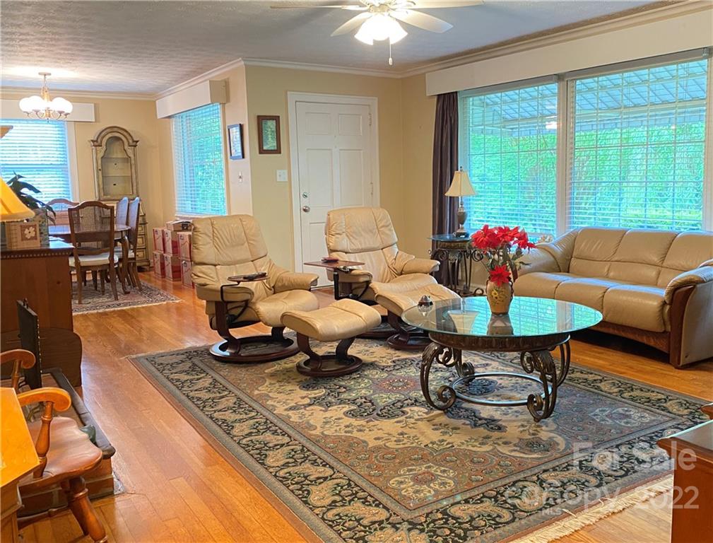 19 Osborne Road Asheville, NC 28804 - Photo 3 of 35 a living room with furniture and a large window