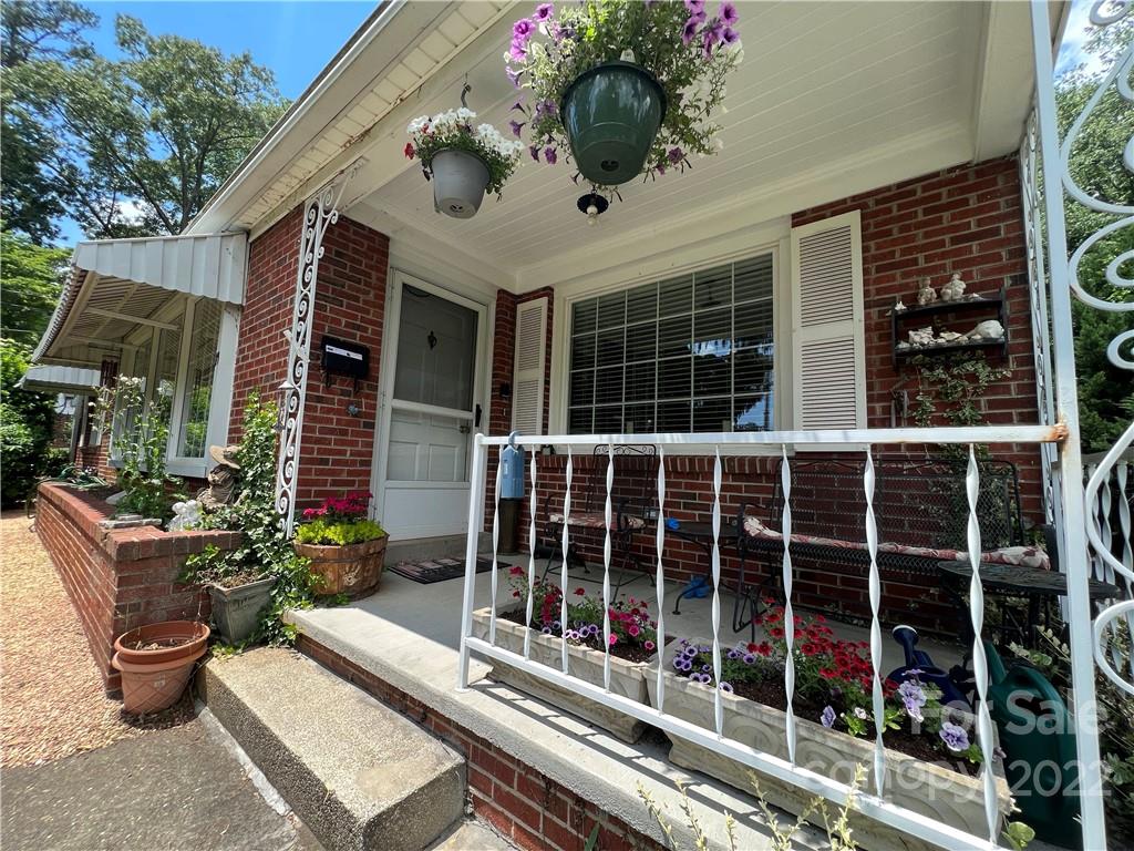 19 Osborne Road Asheville, NC 28804 - Photo 31 of 35 a view of a balcony with chairs potted plants