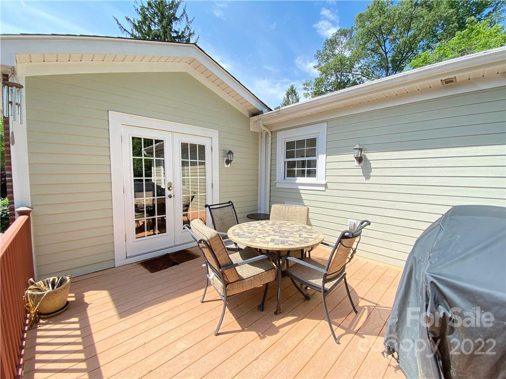 19 Osborne Road Asheville, NC 28804 - Photo 32 of 35 a view of a dinning table and chairs in patio of the house