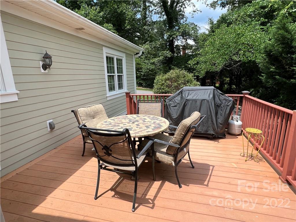 19 Osborne Road Asheville, NC 28804 - Photo 33 of 35 a view of a dinning table and chairs on deck