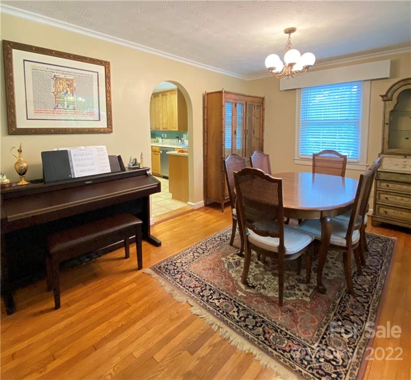 19 Osborne Road Asheville, NC 28804 - Photo 4 of 35 a living room with furniture and a chandelier