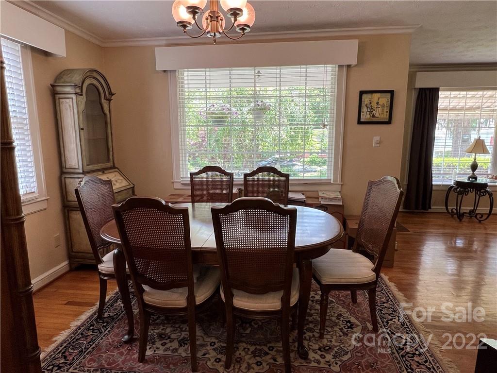 19 Osborne Road Asheville, NC 28804 - Photo 5 of 35 a view of a dining room with furniture window and wooden floor
