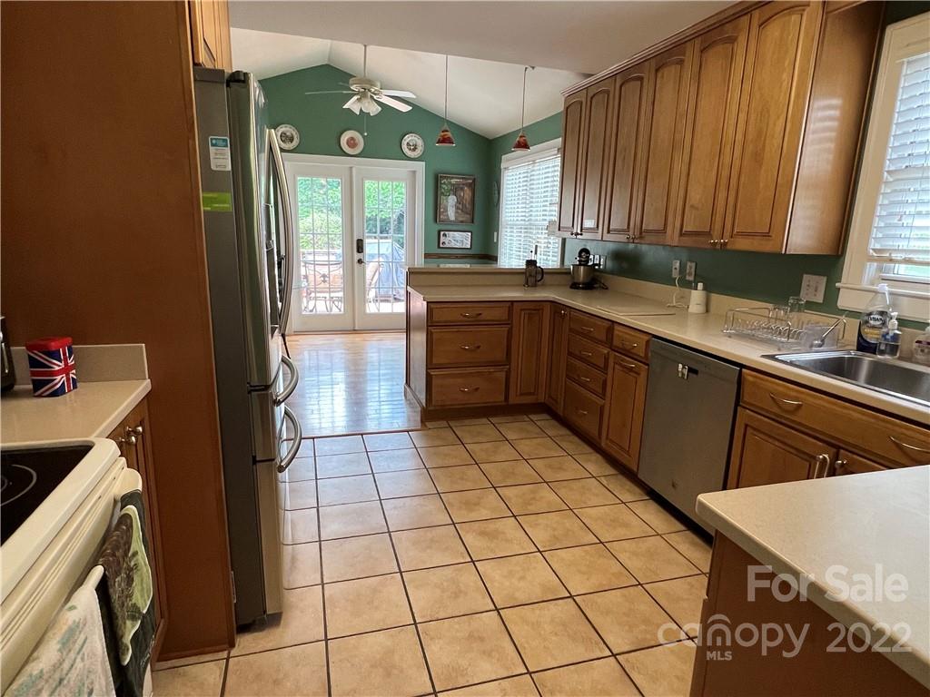 19 Osborne Road Asheville, NC 28804 - Photo 10 of 35 a kitchen with a sink a stove cabinets and a counter top space