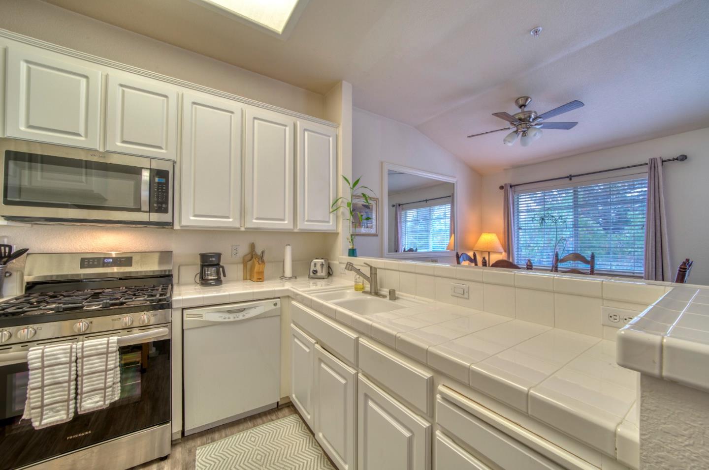 121 Skyline Drive San Ramon, CA 94583 - Photo 6 of 38 a kitchen with stainless steel appliances a stove a sink and cabinets