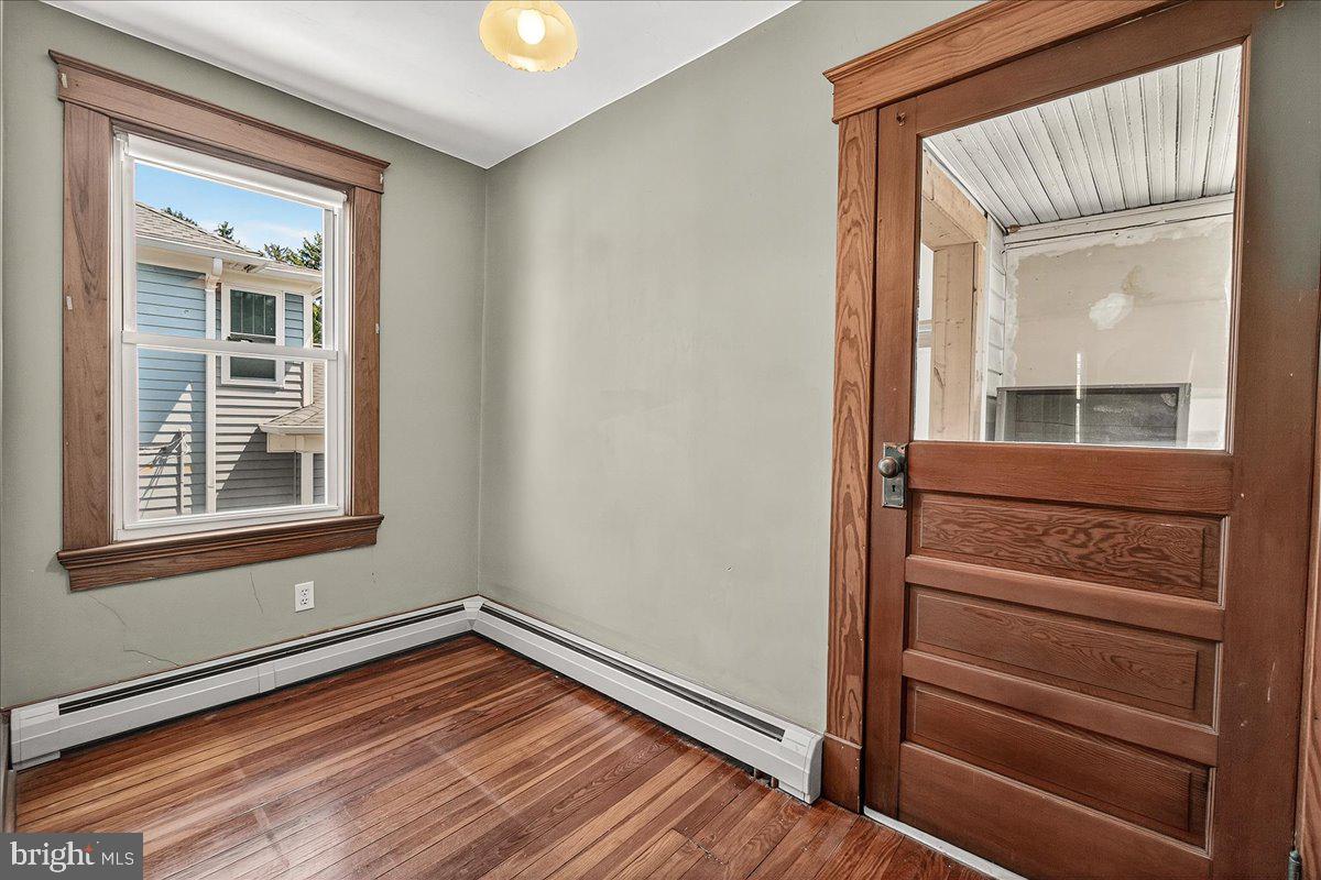 206 Prospect Street Middletown, MD 21769 - Photo 15 of 47 a view of a hallway with wooden floor and cabinet